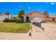 Charming single-story home with well-manicured lawn, desert landscaping, and boat parked in the driveway at 3237 W Angela Dr, Phoenix, AZ 85053