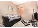 Multi-purpose bedroom featuring a daybed, a small treadmill, and neutral decor for a versatile space at 3519 E Bridgeport Pkwy, Gilbert, AZ 85295
