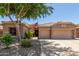 Charming home exterior with a well-maintained yard, three-car garage, and an American flag displayed at 3519 E Bridgeport Pkwy, Gilbert, AZ 85295