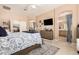 A main bedroom featuring a ceiling fan, a full dresser, neutral carpet and walk-in closet at 3519 E Bridgeport Pkwy, Gilbert, AZ 85295