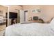 Comfortable bedroom offers closet space and a king bed with a patterned gray and white comforter at 3519 E Bridgeport Pkwy, Gilbert, AZ 85295