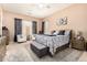 A spacious main bedroom featuring stylish decor, a ceiling fan, and neutral wall color at 3519 E Bridgeport Pkwy, Gilbert, AZ 85295