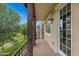 Balcony with views of the green space, an exterior door, and a concrete patio at 3687 E Leslie Dr, Gilbert, AZ 85296