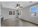 Bright, spacious bedroom with neutral walls, a ceiling fan, and windows offering ample natural light at 3687 E Leslie Dr, Gilbert, AZ 85296