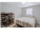 Comfortable bedroom featuring ample storage space with shelves for shoes and a cozy bed at 3687 E Leslie Dr, Gilbert, AZ 85296