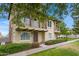 Two story home featuring two balconies, a desert landscape, and manicured hedges at 3687 E Leslie Dr, Gilbert, AZ 85296