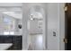 Hallway with light wood floors that connects kitchen with view of living area featuring neutral paint at 3687 E Leslie Dr, Gilbert, AZ 85296