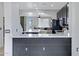 Contemporary kitchen overlooking living room, featuring granite countertops, black cabinets, and stainless steel appliances at 3687 E Leslie Dr, Gilbert, AZ 85296