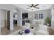 Open living area with kitchen view, featuring stylish furniture and bright lighting at 3687 E Leslie Dr, Gilbert, AZ 85296