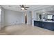 Spacious living room showcasing light wood floors and neutral walls with an open layout leading to other rooms at 3687 E Leslie Dr, Gilbert, AZ 85296