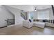 Spacious living room with hardwood floors, large sectional sofa, and staircase with black railings at 3687 E Leslie Dr, Gilbert, AZ 85296