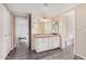Bright bathroom featuring granite countertops and a classic vanity at 3710 E Mercer Ln, Phoenix, AZ 85028