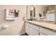 Bathroom with granite countertop, white cabinets and large mirror. Bright and clean at 3710 E Mercer Ln, Phoenix, AZ 85028