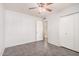 Clean and simple bedroom with tiled floor and closet at 3710 E Mercer Ln, Phoenix, AZ 85028