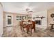 Cozy dining room featuring tile flooring, a dining set, and a white brick fireplace at 3710 E Mercer Ln, Phoenix, AZ 85028