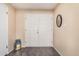 Clean entryway featuring tile flooring, white double doors, and neutral walls at 3710 E Mercer Ln, Phoenix, AZ 85028