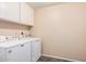 Functional laundry area featuring washer and dryer units with ample space at 3710 E Mercer Ln, Phoenix, AZ 85028