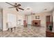 Versatile living room with ceiling fans, tile floors, and plenty of natural light at 3710 E Mercer Ln, Phoenix, AZ 85028