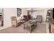 Inviting living room with cozy seating, a patterned rug, and a view into the entryway at 3710 E Mercer Ln, Phoenix, AZ 85028
