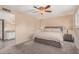 Inviting main bedroom with plush carpeting and an ensuite bathroom at 3710 E Mercer Ln, Phoenix, AZ 85028