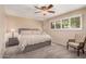 Serene main bedroom featuring plantation shutters, a ceiling fan, and plush carpeting at 3710 E Mercer Ln, Phoenix, AZ 85028