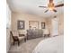 Bright main bedroom with a ceiling fan, neutral tones, and comfortable furnishings at 3710 E Mercer Ln, Phoenix, AZ 85028