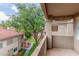 Inviting balcony space with views of green lawn and mature trees at 3830 E Lakewood Pkwy # 3099, Phoenix, AZ 85048