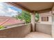 Large balcony with views of lush landscaping and red tile roofs at 3830 E Lakewood Pkwy # 3099, Phoenix, AZ 85048