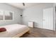 Simple bedroom with hardwood floors, neutral walls and a minimalist aesthetic at 3830 E Lakewood Pkwy # 3099, Phoenix, AZ 85048