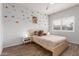 Cozy bedroom with wood flooring and a neutral color palette at 3830 E Lakewood Pkwy # 3099, Phoenix, AZ 85048