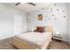Bright bedroom featuring hardwood floors, soft colors and a ceiling fan at 3830 E Lakewood Pkwy # 3099, Phoenix, AZ 85048