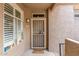 Front door with security screen, window, and welcome mat at 3830 E Lakewood Pkwy # 3099, Phoenix, AZ 85048