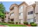 Condo building showing lush landscaping, exterior staircases, and an inviting courtyard at 3830 E Lakewood Pkwy # 3099, Phoenix, AZ 85048