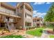 Exterior of the apartment building showcasing staircases, balconies, and well-maintained landscaping at 3830 E Lakewood Pkwy # 3099, Phoenix, AZ 85048