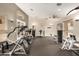 Bright and airy gym with vaulted ceilings, offering a wide range of modern exercise equipment for residents at 3830 E Lakewood Pkwy # 3099, Phoenix, AZ 85048
