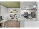 Bright open-concept kitchen connected to the office space with green ceiling at 3830 E Lakewood Pkwy # 3099, Phoenix, AZ 85048