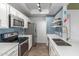 Well-equipped kitchen featuring stainless steel appliances and a stylish blue tile backsplash at 3830 E Lakewood Pkwy # 3099, Phoenix, AZ 85048