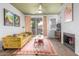 Bright living room features a fireplace, a sliding glass door, and contemporary decor at 3830 E Lakewood Pkwy # 3099, Phoenix, AZ 85048