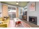 Cozy living room features a fireplace, sliding glass door and stylish decor at 3830 E Lakewood Pkwy # 3099, Phoenix, AZ 85048