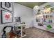 Well-lit office with white walls, green ceiling, modern desk, and built-in shelves at 3830 E Lakewood Pkwy # 3099, Phoenix, AZ 85048