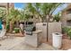 Outdoor grilling area with a built-in BBQ, prep space, and nearby seating, perfect for community gatherings at 3830 E Lakewood Pkwy # 3099, Phoenix, AZ 85048