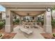 Covered outdoor lounge area with comfortable seating and a tranquil setting, ideal for relaxation and socializing at 3830 E Lakewood Pkwy # 3099, Phoenix, AZ 85048