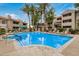 Inviting community pool and spa surrounded by lush landscaping, lounge chairs, and well-maintained grounds at 3830 E Lakewood Pkwy # 3099, Phoenix, AZ 85048