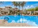 Stunning community pool with water feature, surrounded by well-manicured landscaping, lounge areas, and relaxing ambiance at 3830 E Lakewood Pkwy # 3099, Phoenix, AZ 85048