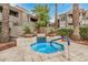 Secluded community spa with tile accents, surrounded by mature landscaping for a private and relaxing retreat at 3830 E Lakewood Pkwy # 3099, Phoenix, AZ 85048
