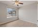 Bedroom features hardwood floors, a ceiling fan and blinds for privacy with natural light at 3973 W Hearn Rd, Phoenix, AZ 85053