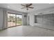 Spacious bedroom features vinyl floors, a ceiling fan, sliding glass door, and mirrored closets at 3973 W Hearn Rd, Phoenix, AZ 85053