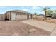 Driveway with gravel leading to the two-car garage at 3973 W Hearn Rd, Phoenix, AZ 85053