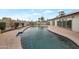 Inviting backyard pool featuring desert landscaping, an American flag, and desert landscaping at 3973 W Hearn Rd, Phoenix, AZ 85053