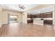Living room and kitchen feature an open floor plan and tile floors at 42213 W Santa Fe St, Maricopa, AZ 85138